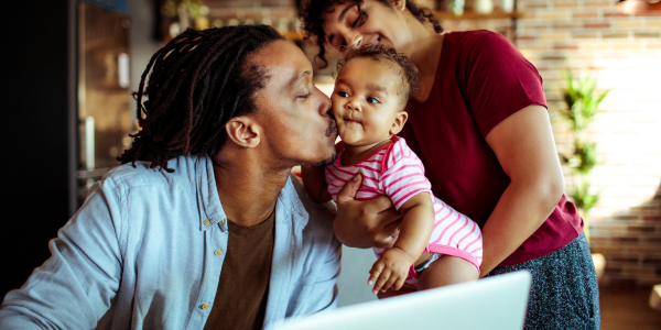 Personal Checking & Savings Image of Dad kissing baby