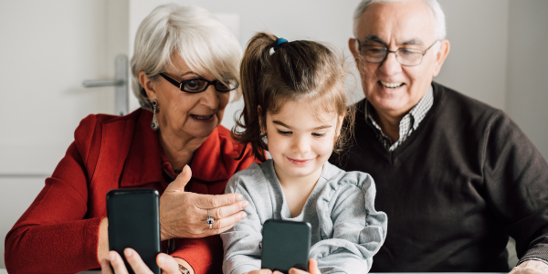 child taking selfie with grandparents