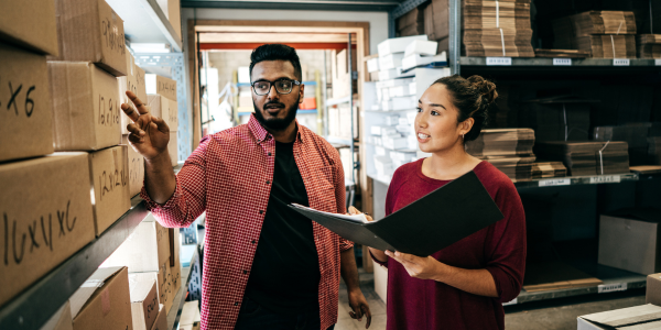 Business owners looking at inventory