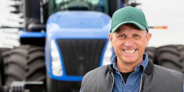 farmer in front of tractor