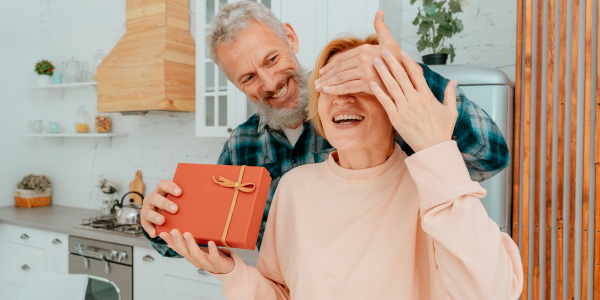 Man giving gift to woman