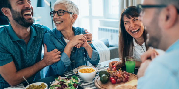 People laughing at dinner