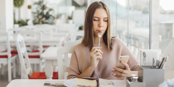 Teenage girl using Face ID to log in to her Star Bank MN app